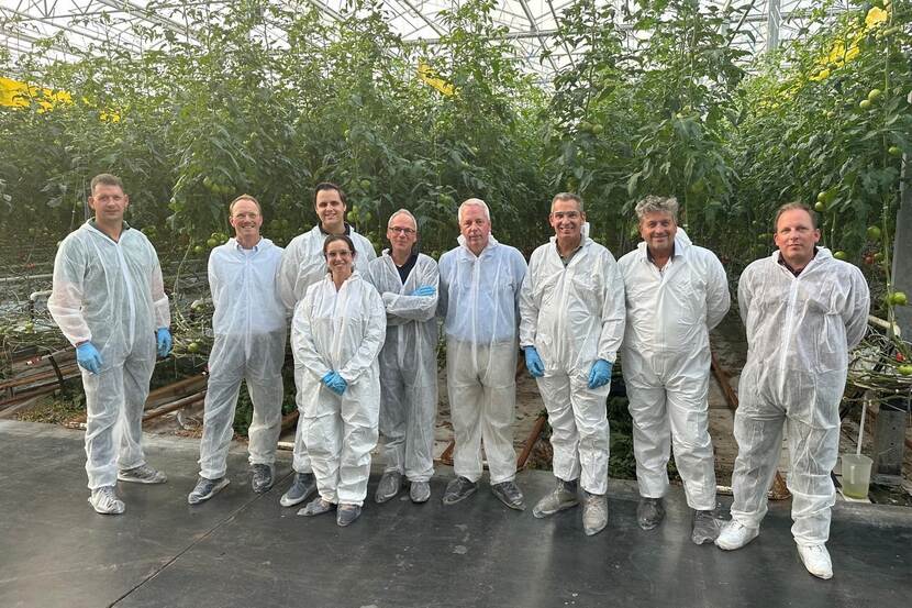 group of people in a greenhouse