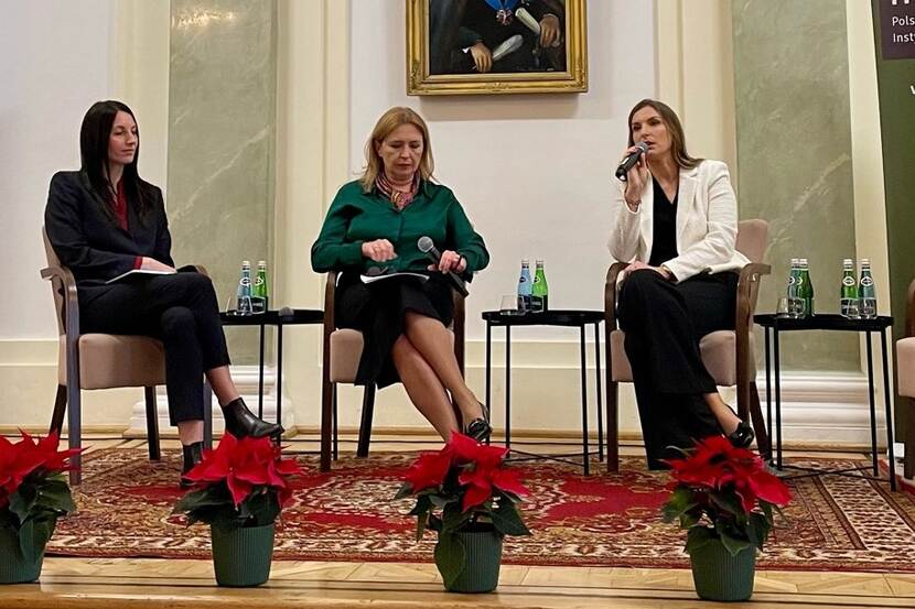 Three women sitting in the panel discussion