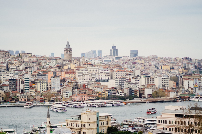 River in the forefront and many buildings in the background in Istanbul